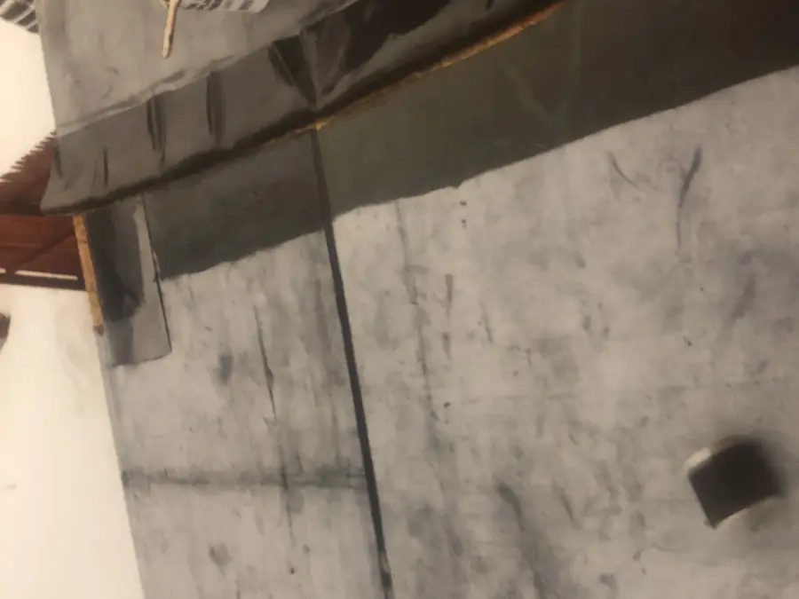 Rubber EPDM roof membrane being repaired
